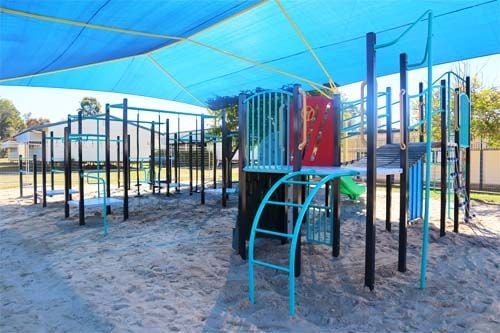outdoor playground with double yellow slide