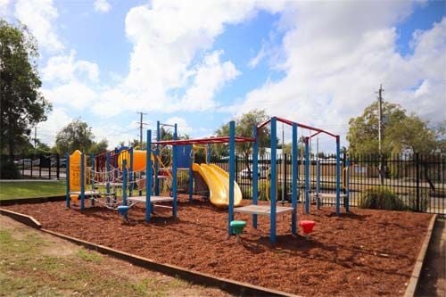 outdoor playground with double yellow slide