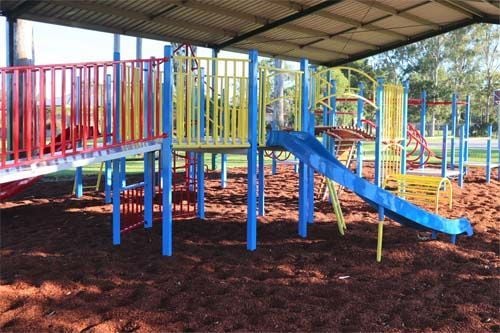 back view of undercover red, yellow and blue playground